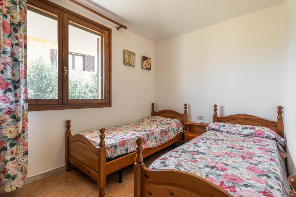 Łóżko lub łóżka w pokoju w obiekcie Casa Nicoletta