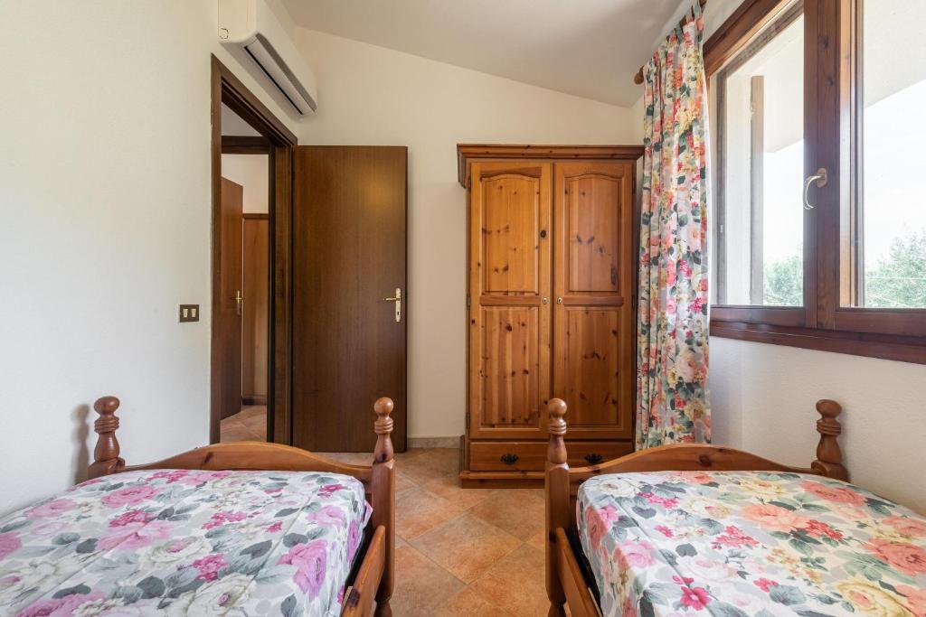 Łóżko lub łóżka w pokoju w obiekcie Casa Nicoletta