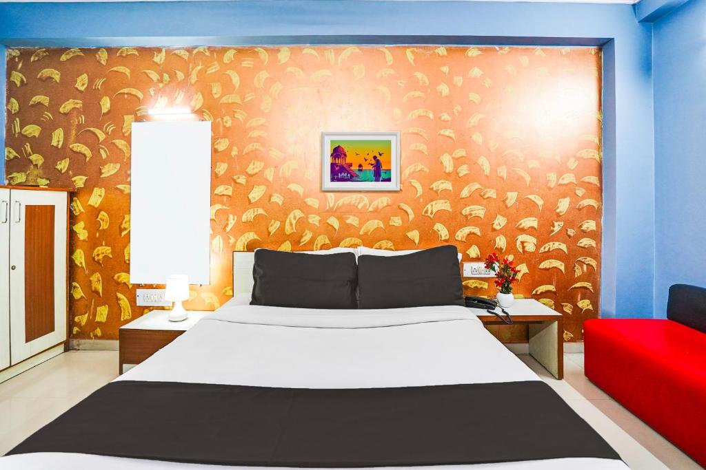 Postel nebo postele na pokoji v ubytování Super Hotel O Vibrant Residency