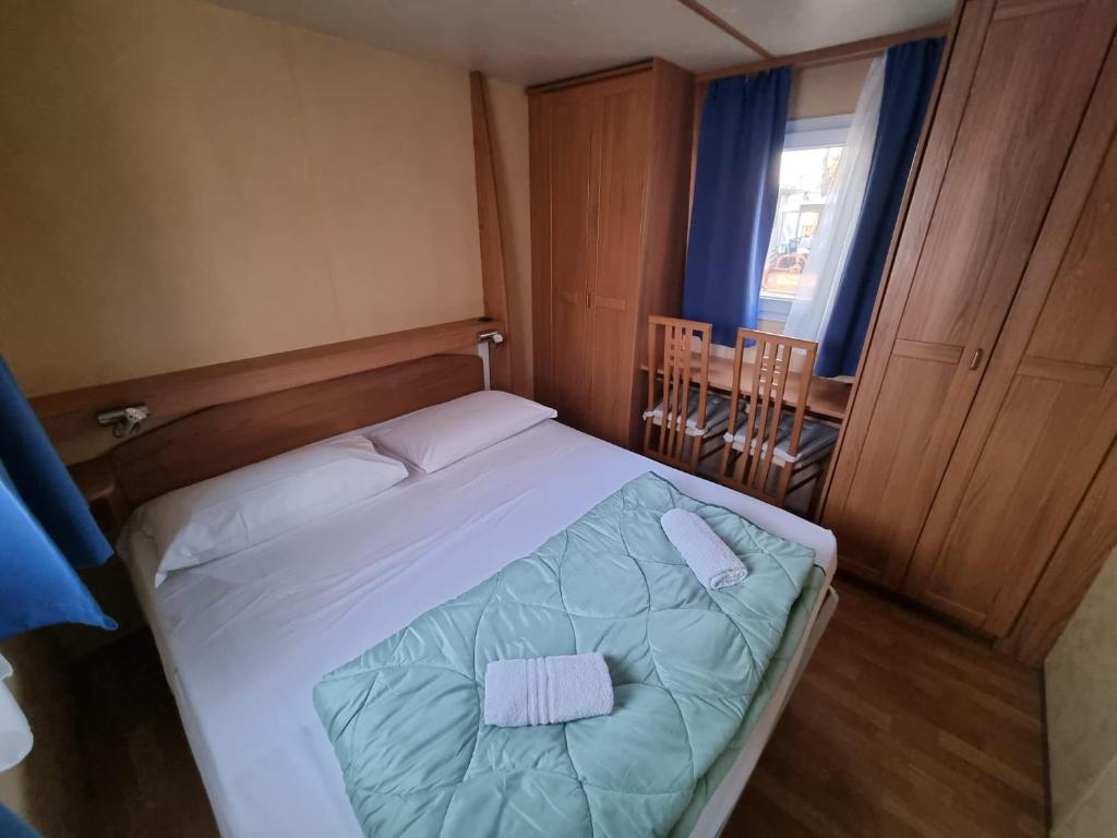 Postel nebo postele na pokoji v ubytování Campeggio Don Bosco