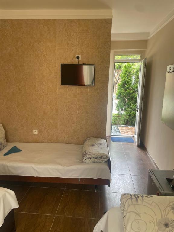 Postel nebo postele na pokoji v ubytování Zangu Hotel
