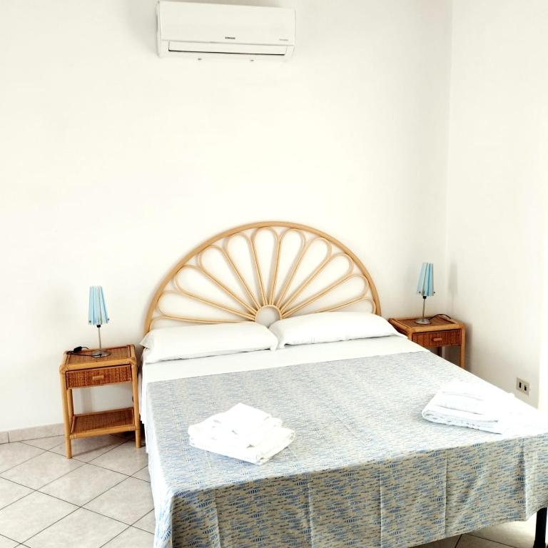 Postel nebo postele na pokoji v ubytování Vento di Terra Ponza