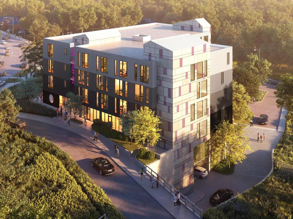 an aerial view of a building with a parking lot at The Artful Way Hotel in Asheville