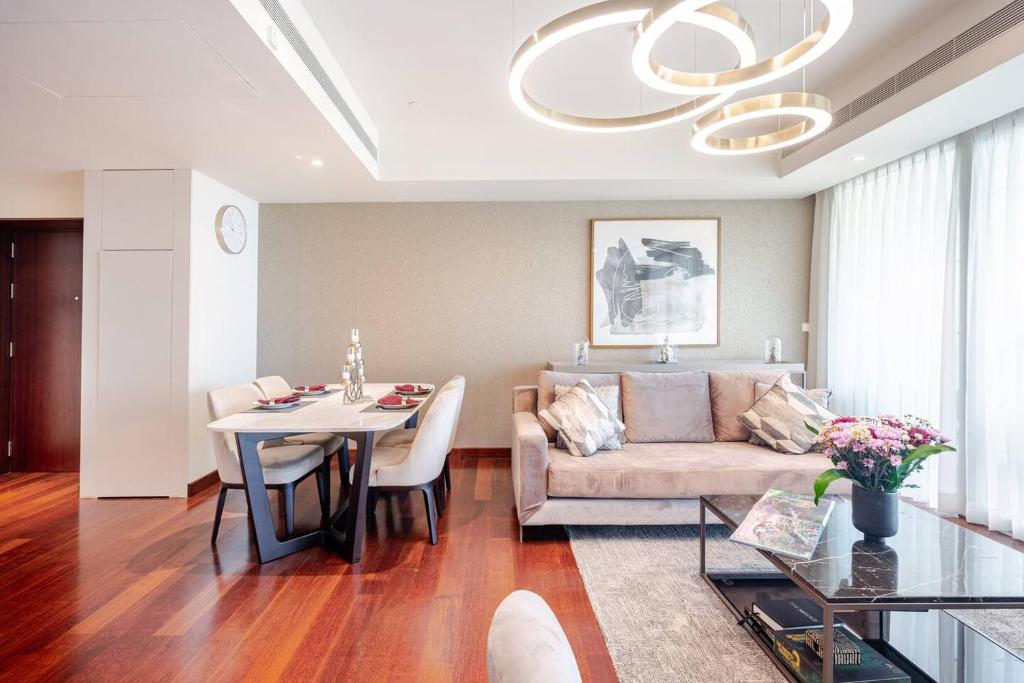 a living room with a couch and a table at Sofia's Luxury Seaview Central Colombo Apartment in Slave Island