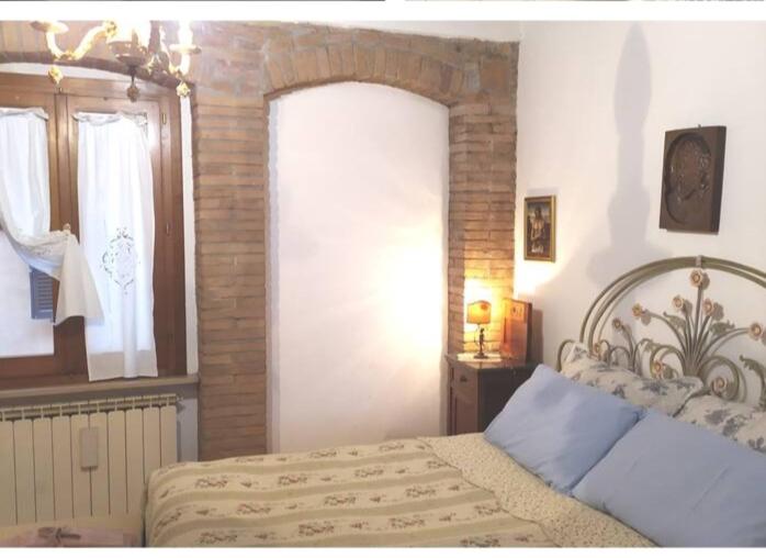Łóżko lub łóżka w pokoju w obiekcie Centro Storico Perugia - Vista Su Assisi