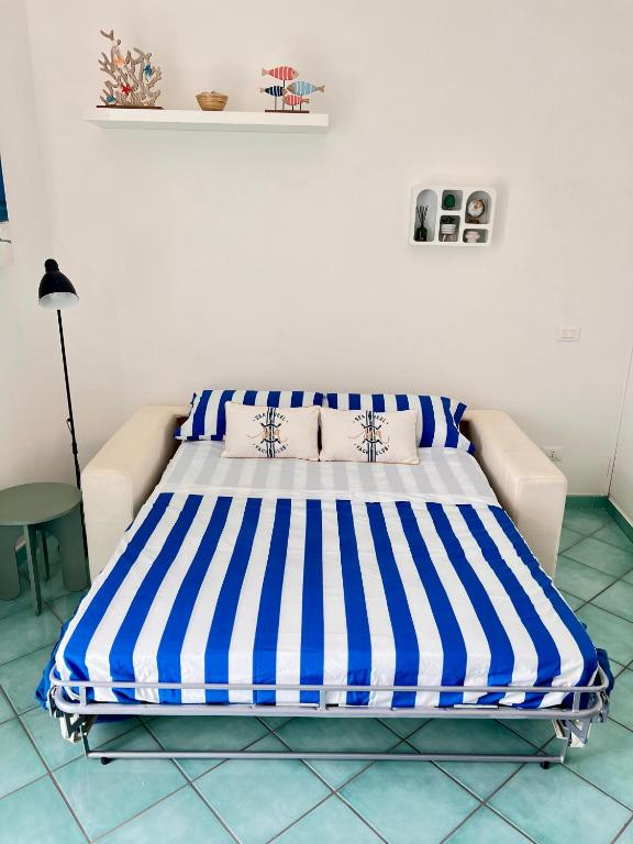 Postel nebo postele na pokoji v ubytování Sea Breeze Ponza