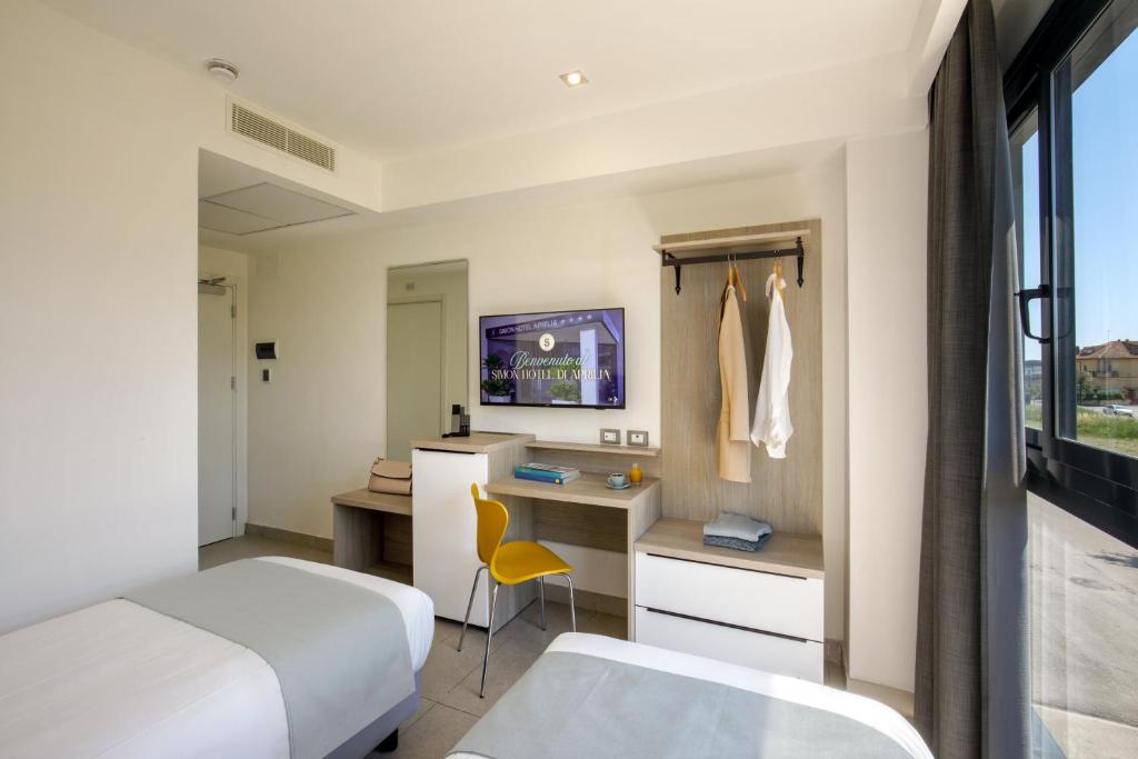 TV a/nebo společenská místnost v ubytování Simon Hotel Aprilia