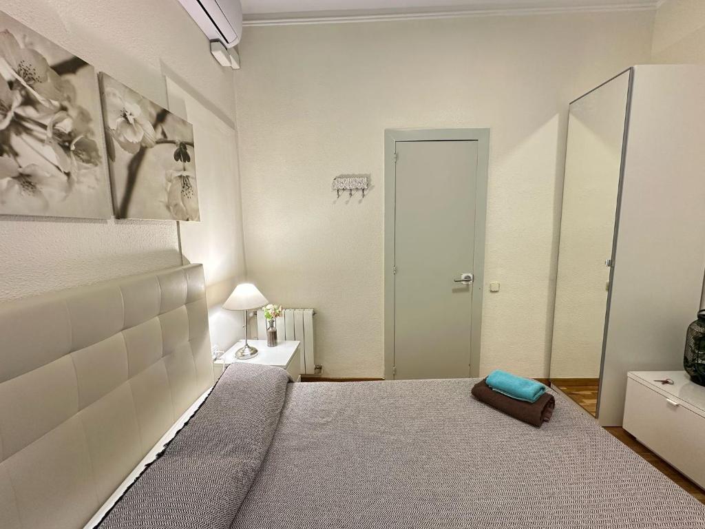 Postel nebo postele na pokoji v ubytování Rooms Aribau