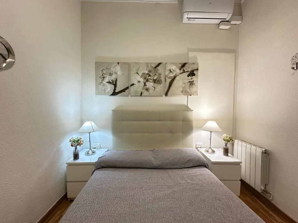 Postel nebo postele na pokoji v ubytování Rooms Aribau