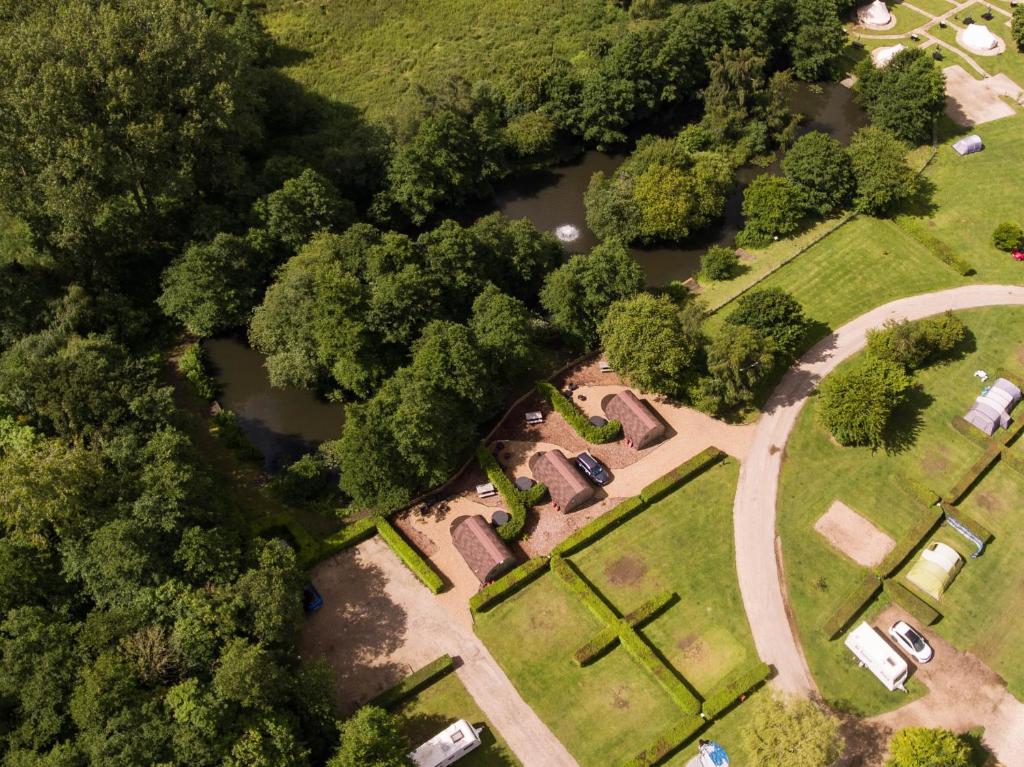 an overhead view of a park with trees and water at Retreats in Norwich