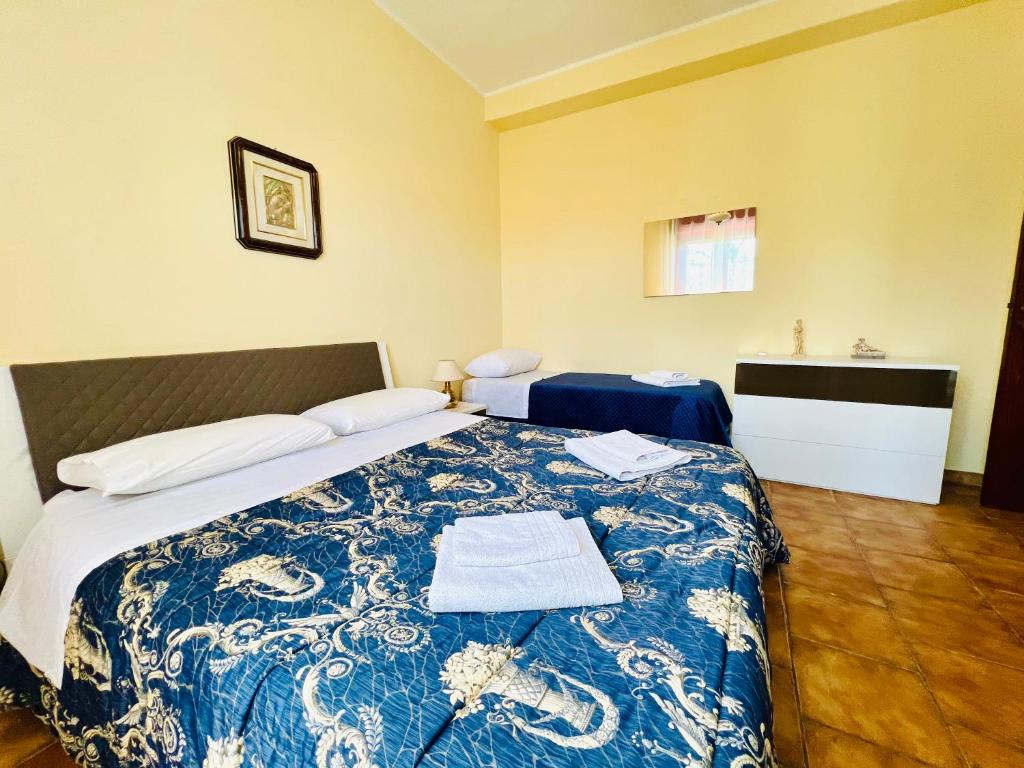 Postel nebo postele na pokoji v ubytování Villa Giada