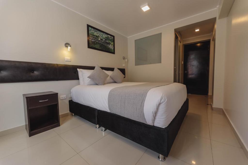 Postel nebo postele na pokoji v ubytování Classic Hotel Cusco