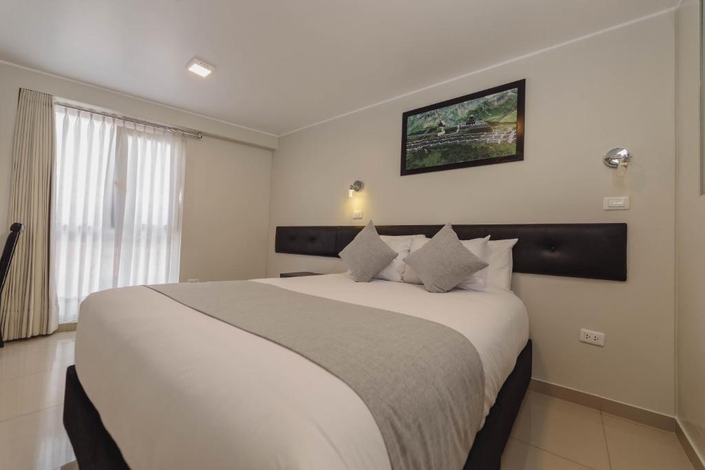Postel nebo postele na pokoji v ubytování Classic Hotel Cusco