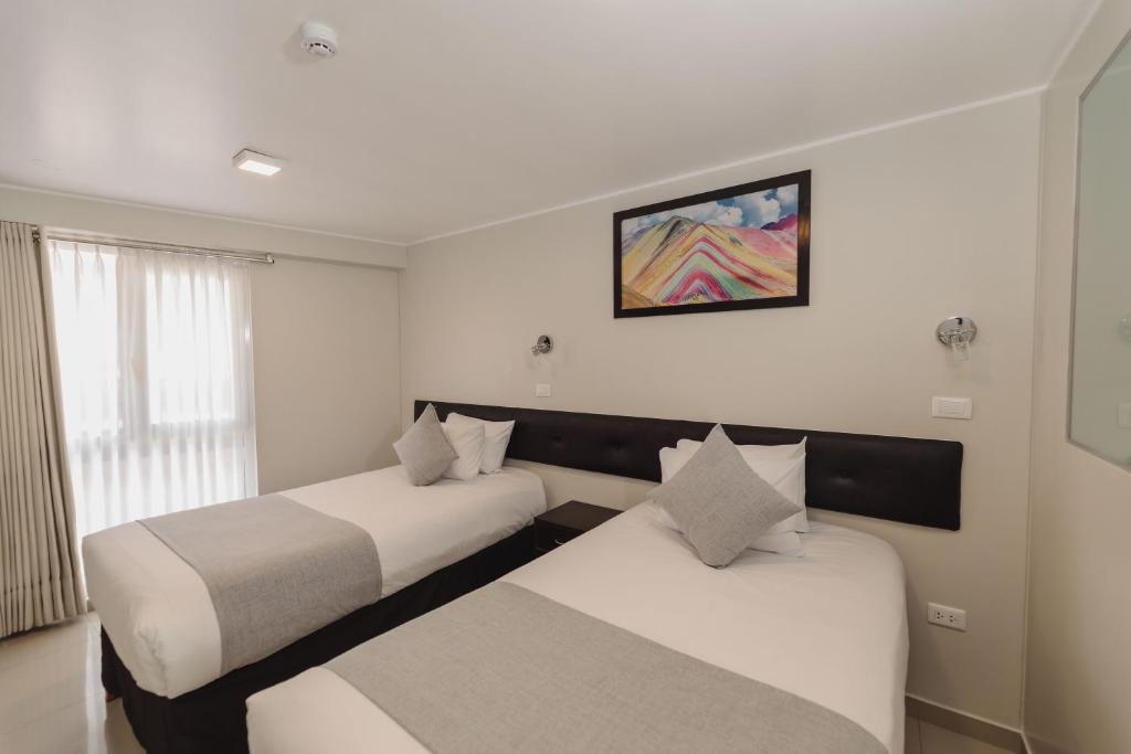 Postel nebo postele na pokoji v ubytování Classic Hotel Cusco