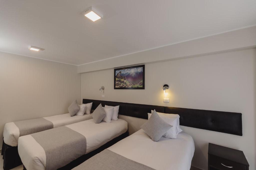 Postel nebo postele na pokoji v ubytování Classic Hotel Cusco