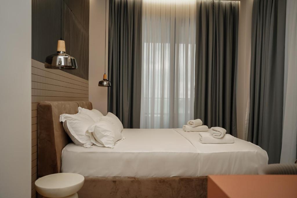 Postel nebo postele na pokoji v ubytování Diamar Suites