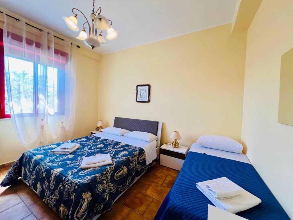 Postel nebo postele na pokoji v ubytování Villa Giada
