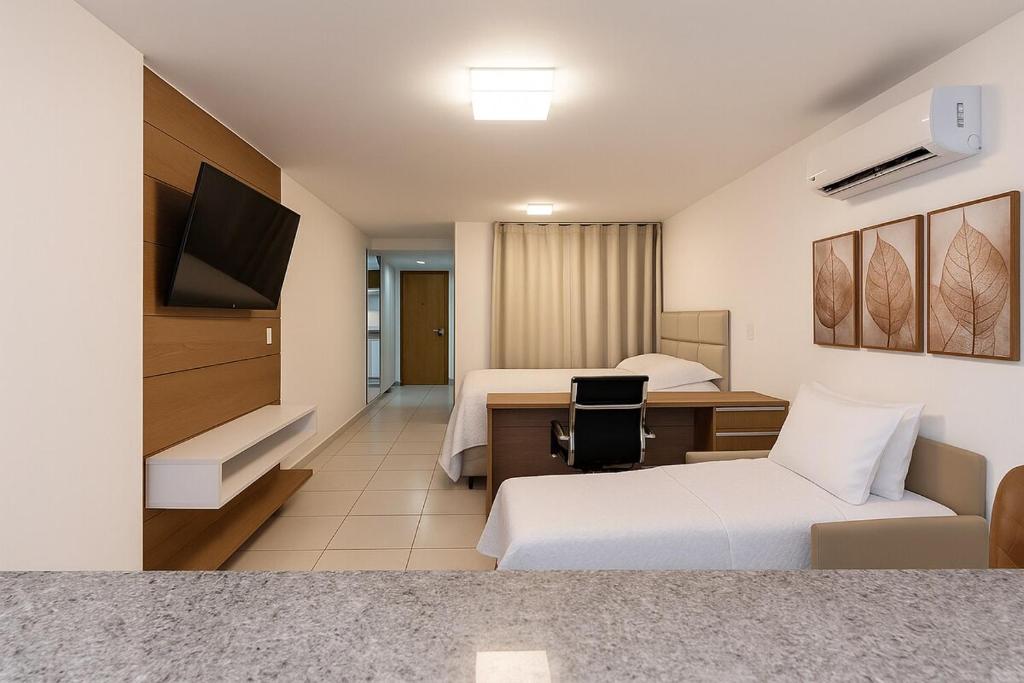 TV a/nebo společenská místnost v ubytování Apartamento Studio Av idependencia Com Ar Condicionado