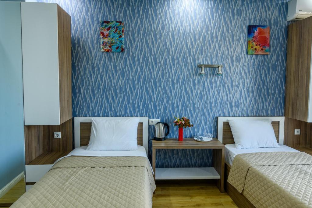 Postel nebo postele na pokoji v ubytování Hotel Sunny