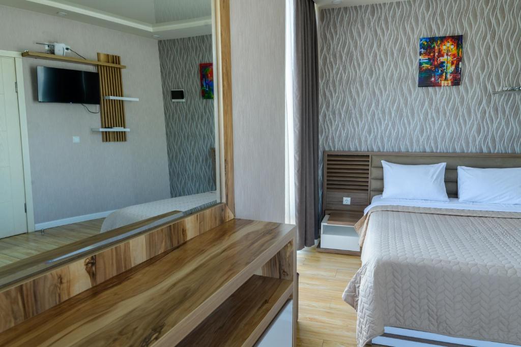 Postel nebo postele na pokoji v ubytování Hotel Sunny