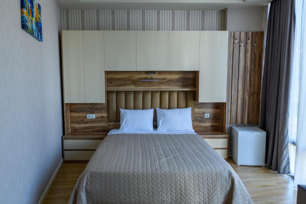 Postel nebo postele na pokoji v ubytování Hotel Sunny