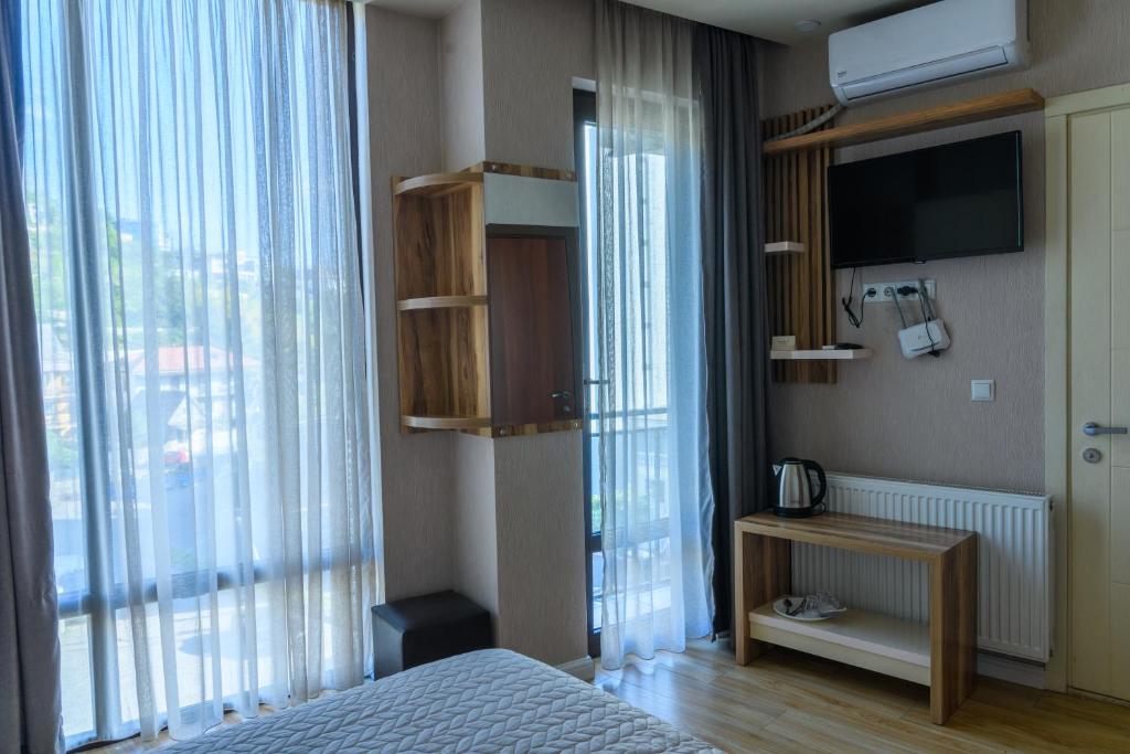Postel nebo postele na pokoji v ubytování Hotel Sunny