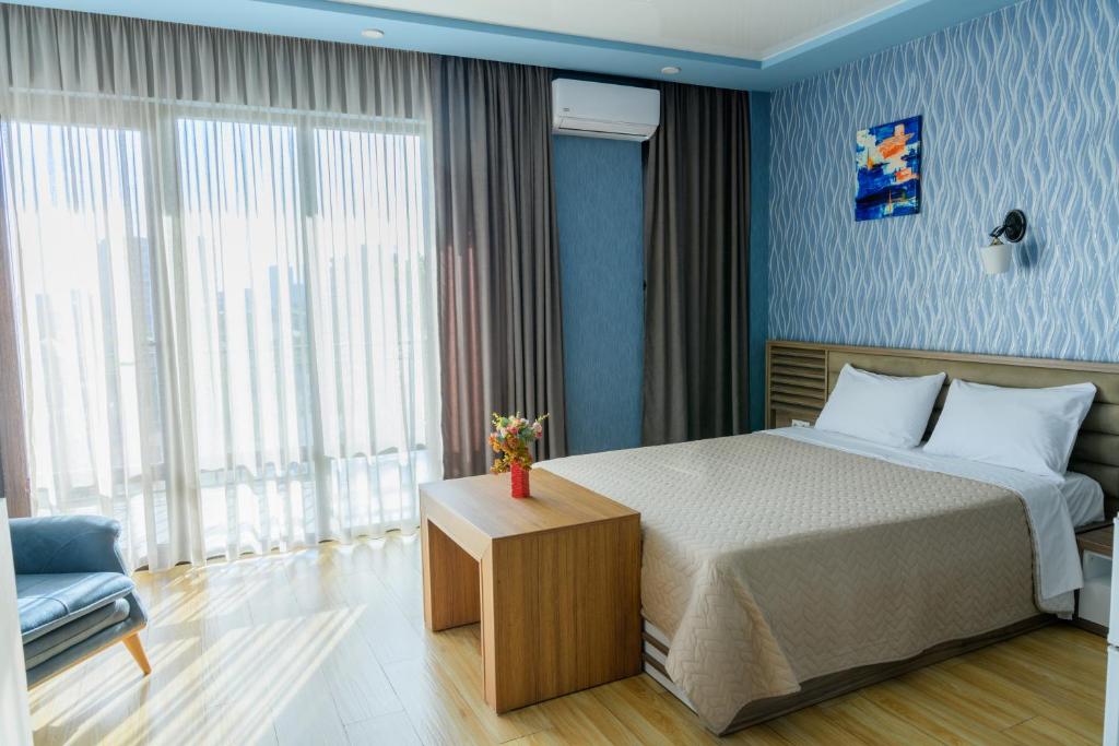Postel nebo postele na pokoji v ubytování Hotel Sunny