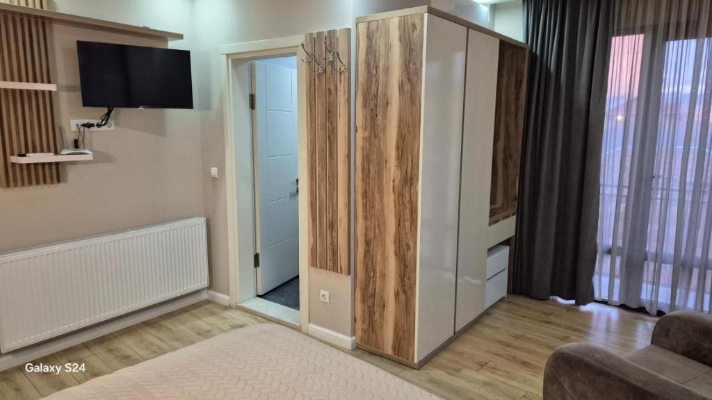 TV a/nebo společenská místnost v ubytování Hotel Sunny