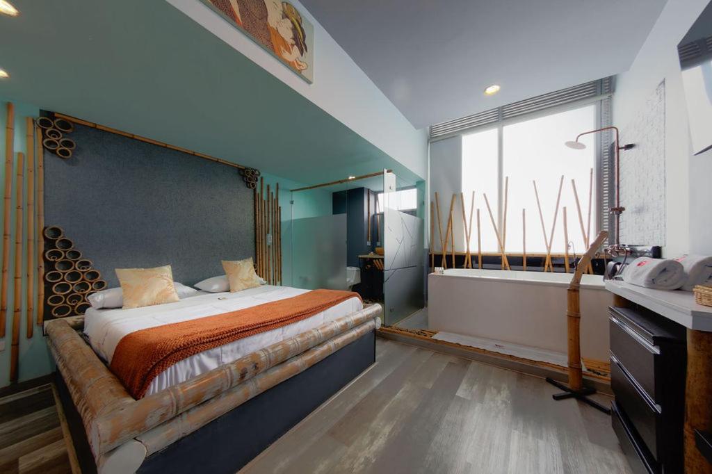 Postel nebo postele na pokoji v ubytování Hotel Zensual