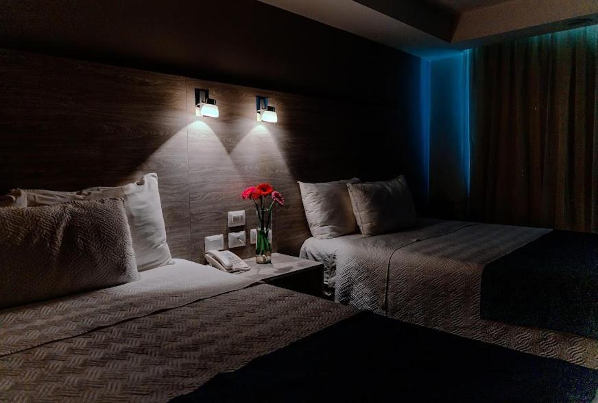 Postel nebo postele na pokoji v ubytování Kasa Hotel & Suites