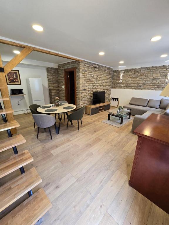 a living room with a couch and a table at Moja Mona in Subotica