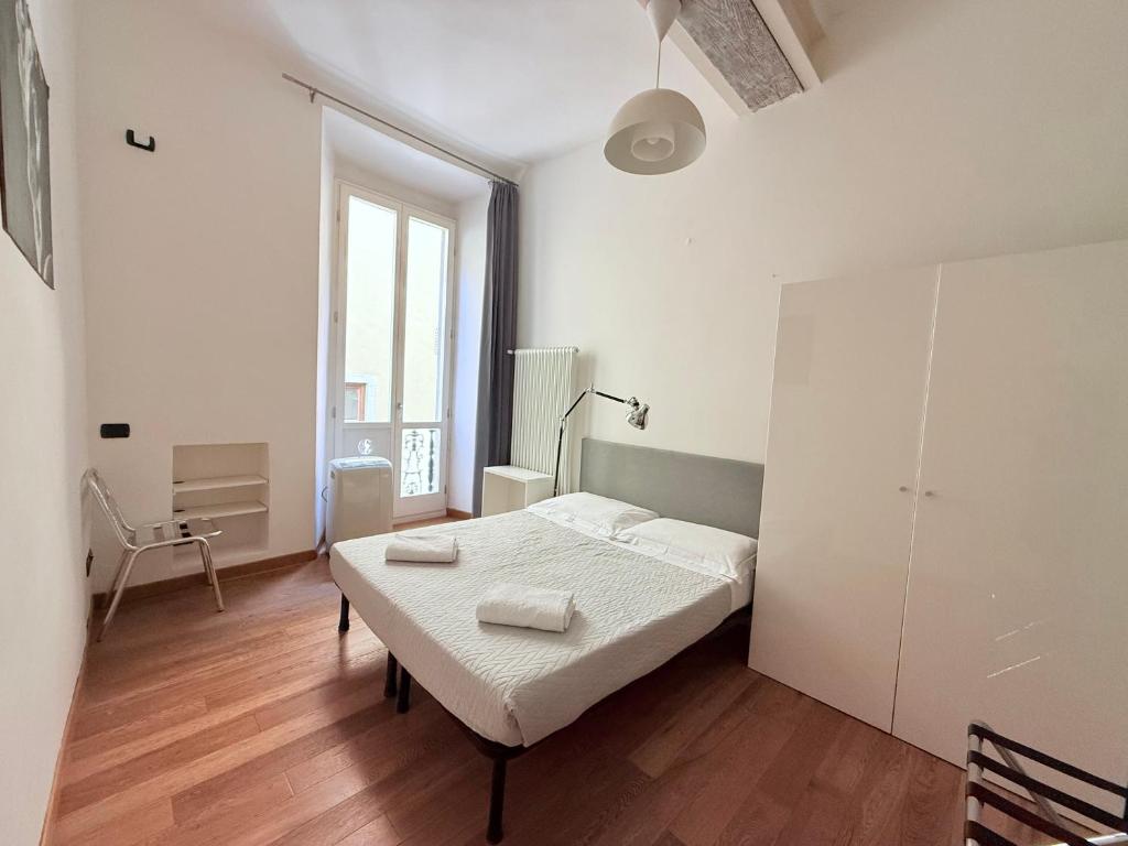 A bed or beds in a room at Signoria Suite 24th