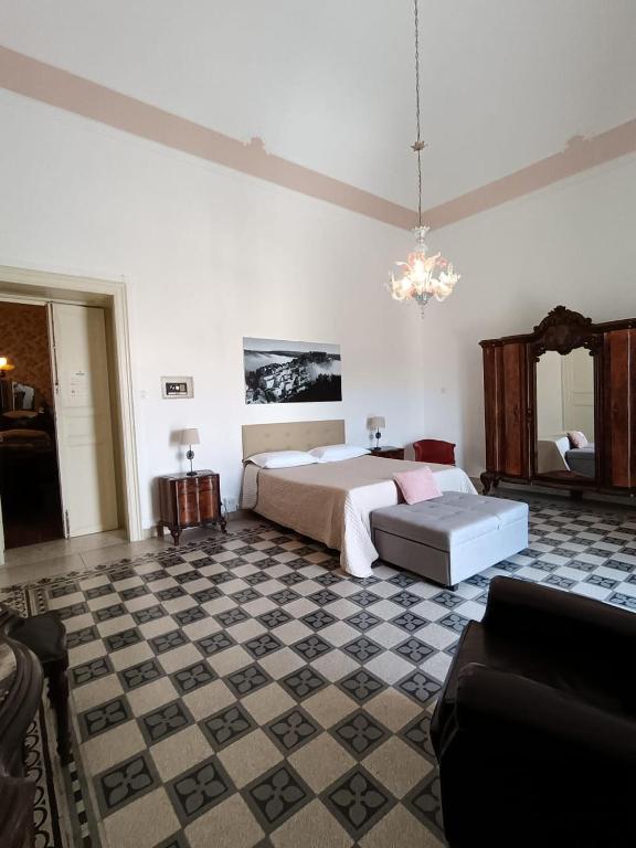 Postel nebo postele na pokoji v ubytování Residenza Donnafugata B&B