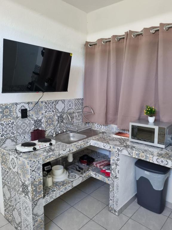 TV a/nebo společenská místnost v ubytování Villas La Vista