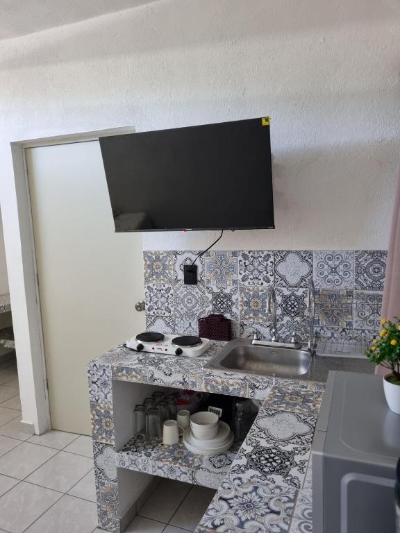 TV a/nebo společenská místnost v ubytování Villas La Vista