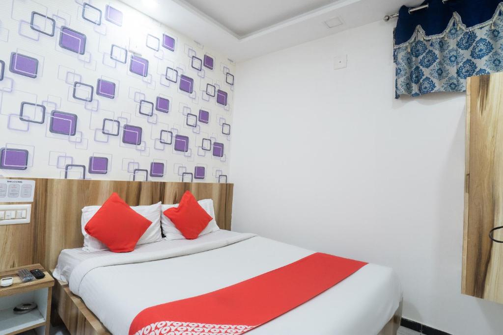 Postel nebo postele na pokoji v ubytování Hotel O Swell