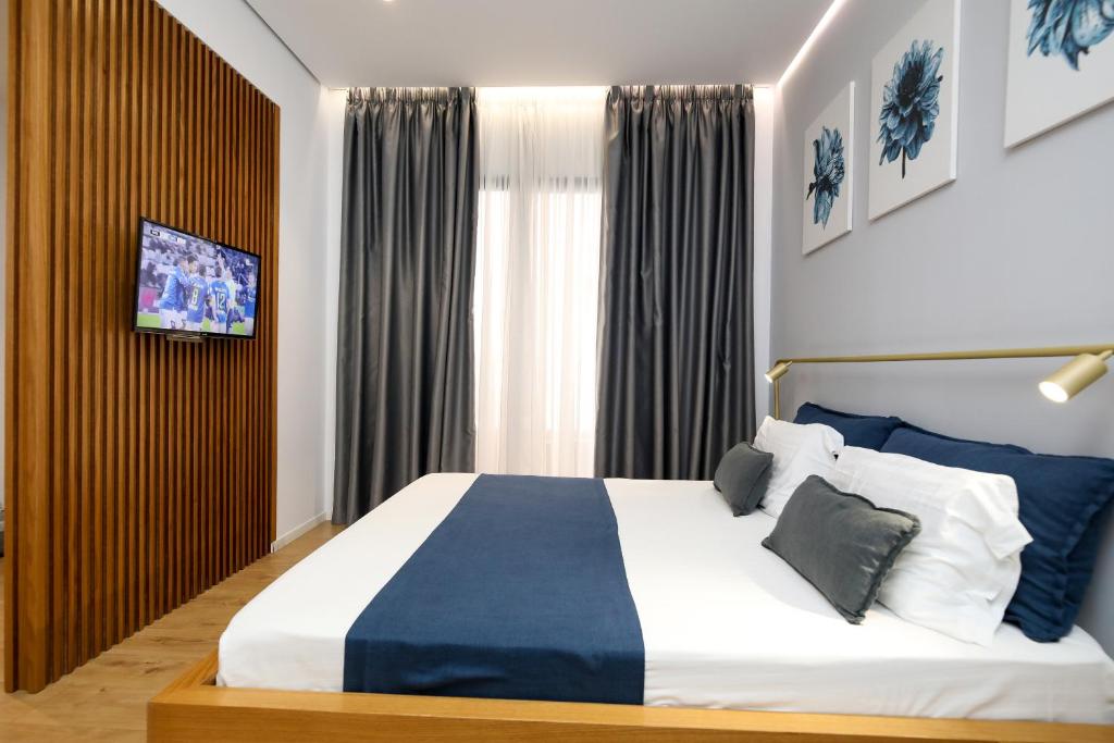 Postel nebo postele na pokoji v ubytování H&M Hotel