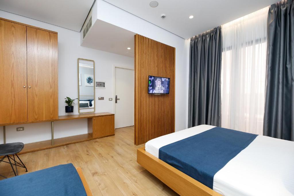 Postel nebo postele na pokoji v ubytování H&M Hotel