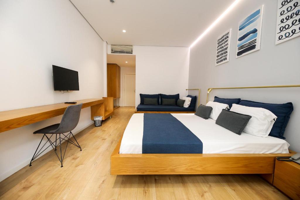 Postel nebo postele na pokoji v ubytování H&M Hotel