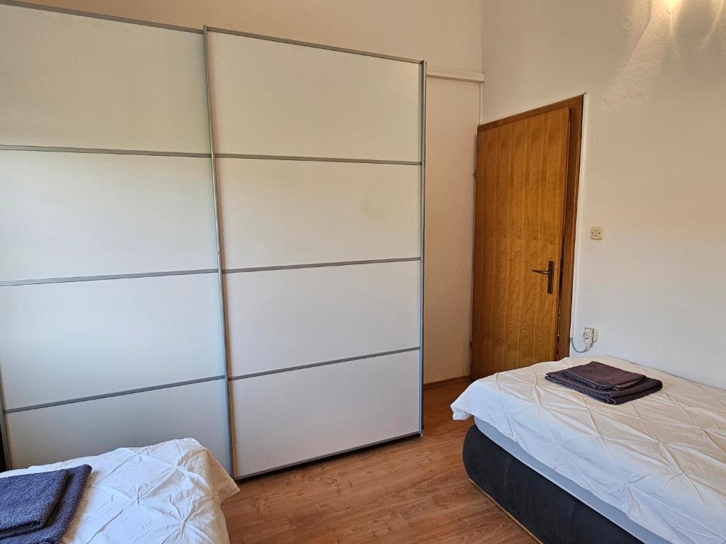 Posteľ alebo postele v izbe v ubytovaní Apartments Maček
