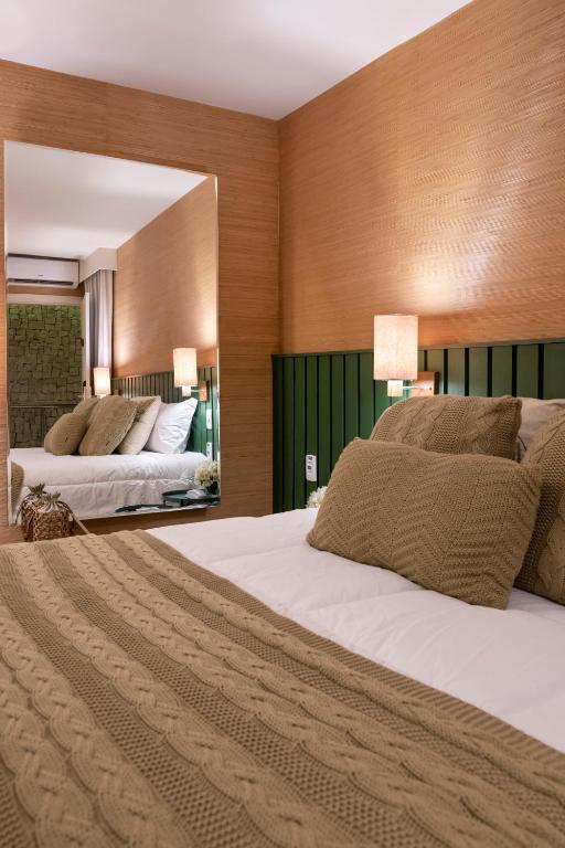 Postel nebo postele na pokoji v ubytování Canto Hotel