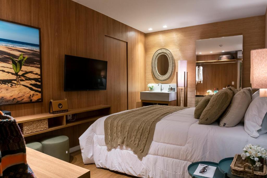 TV a/nebo společenská místnost v ubytování Canto Hotel
