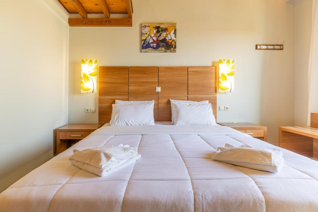 Postel nebo postele na pokoji v ubytování Anassa Hotel