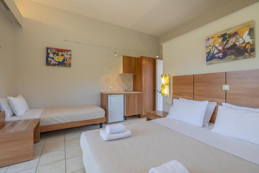 Postel nebo postele na pokoji v ubytování Anassa Hotel