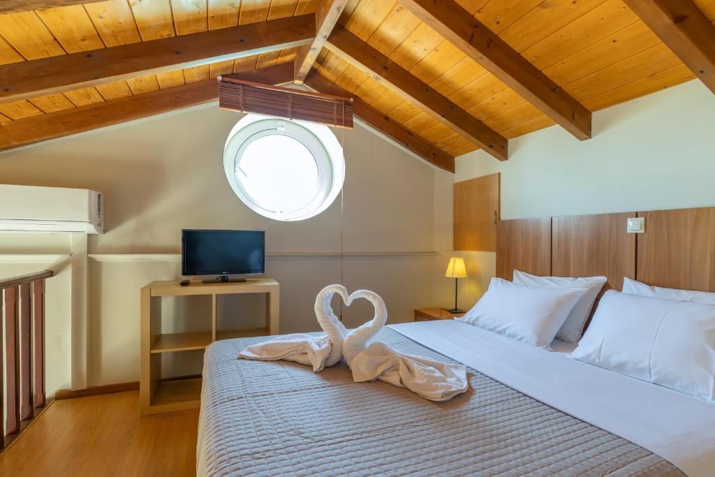 Postel nebo postele na pokoji v ubytování Anassa Hotel