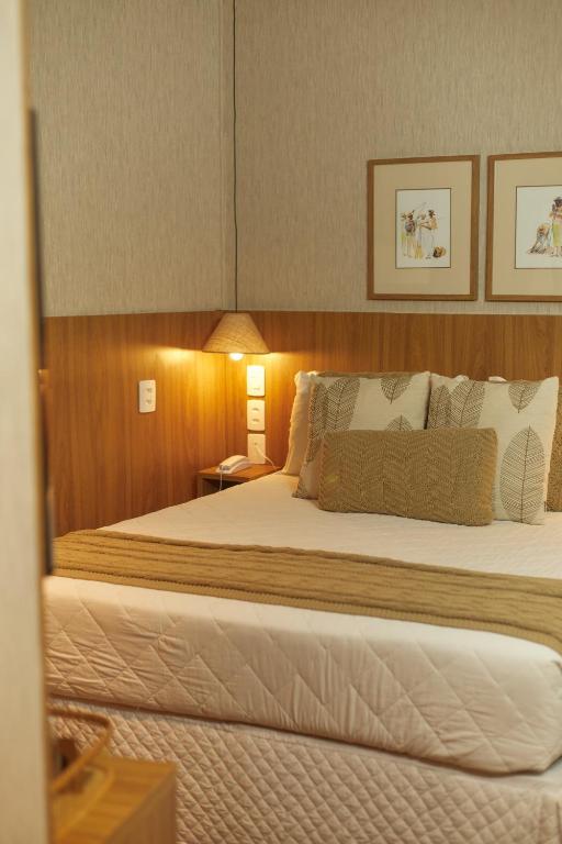 Postel nebo postele na pokoji v ubytování Canto Hotel