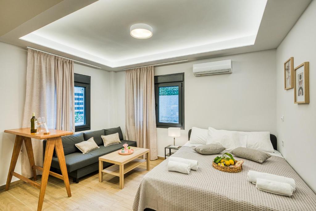 a living room with a bed and a couch at Virginia Haven in Chios