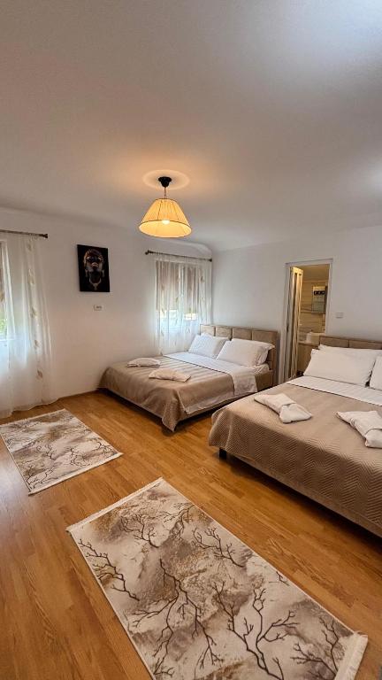 Postel nebo postele na pokoji v ubytování IMPERIUM DK VILLA