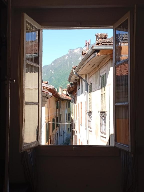an open window with a view of a city at Ca' del Portico in Valsolda