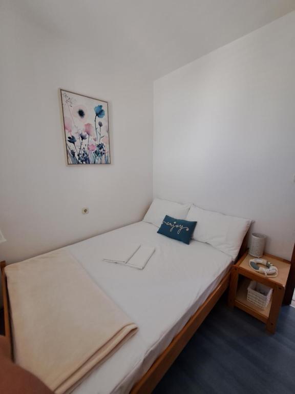 Postel nebo postele na pokoji v ubytování Apartments Galović